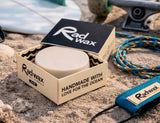 Rad Wax Eco Surf Wax on a beach