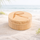 Rad Wax Surf Tin on a beach 